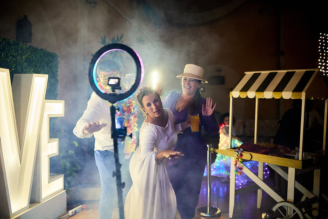 Guests enjoying the 360-camera booth at a wedding in Paris.”