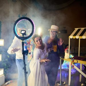 Guests enjoying the 360-camera booth at a wedding in Paris.”